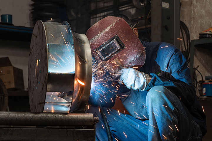 a worker during production of Chosen's industrial fan 01