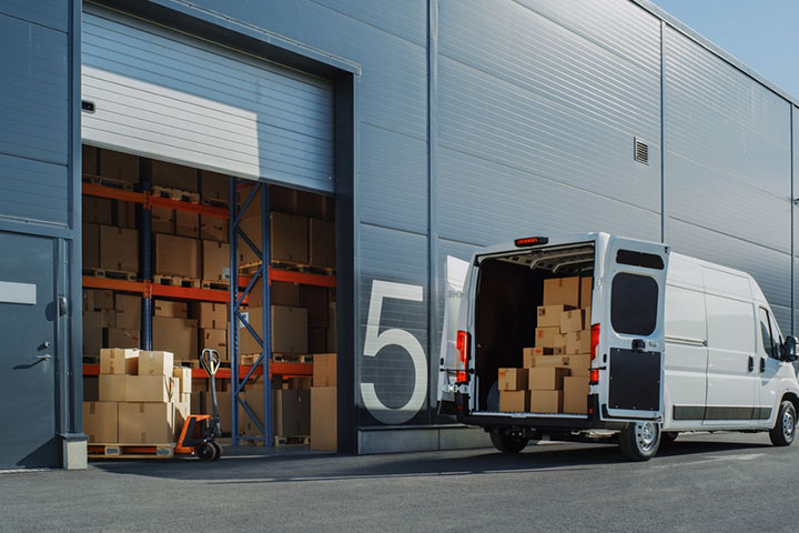 a van carrying boxes of boxed industrial fans 01