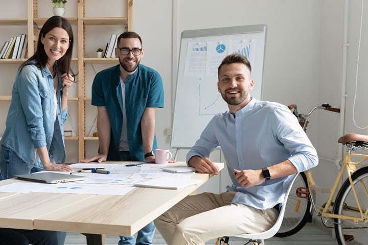 An image of three office workers during a conference 01